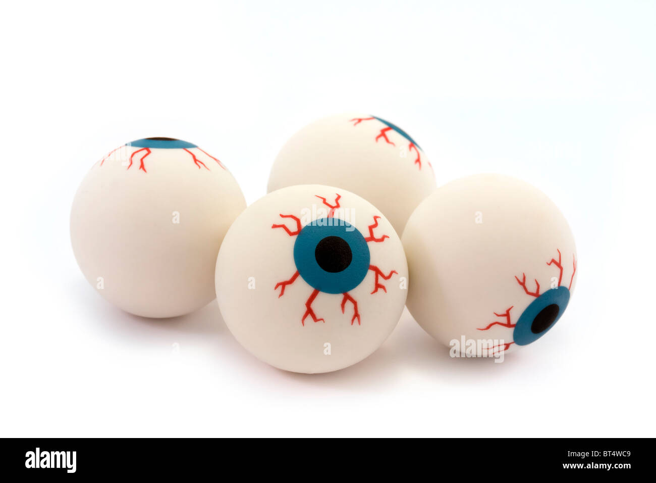 Quatre yeux jouet en caoutchouc isolé sur fond blanc Banque D'Images