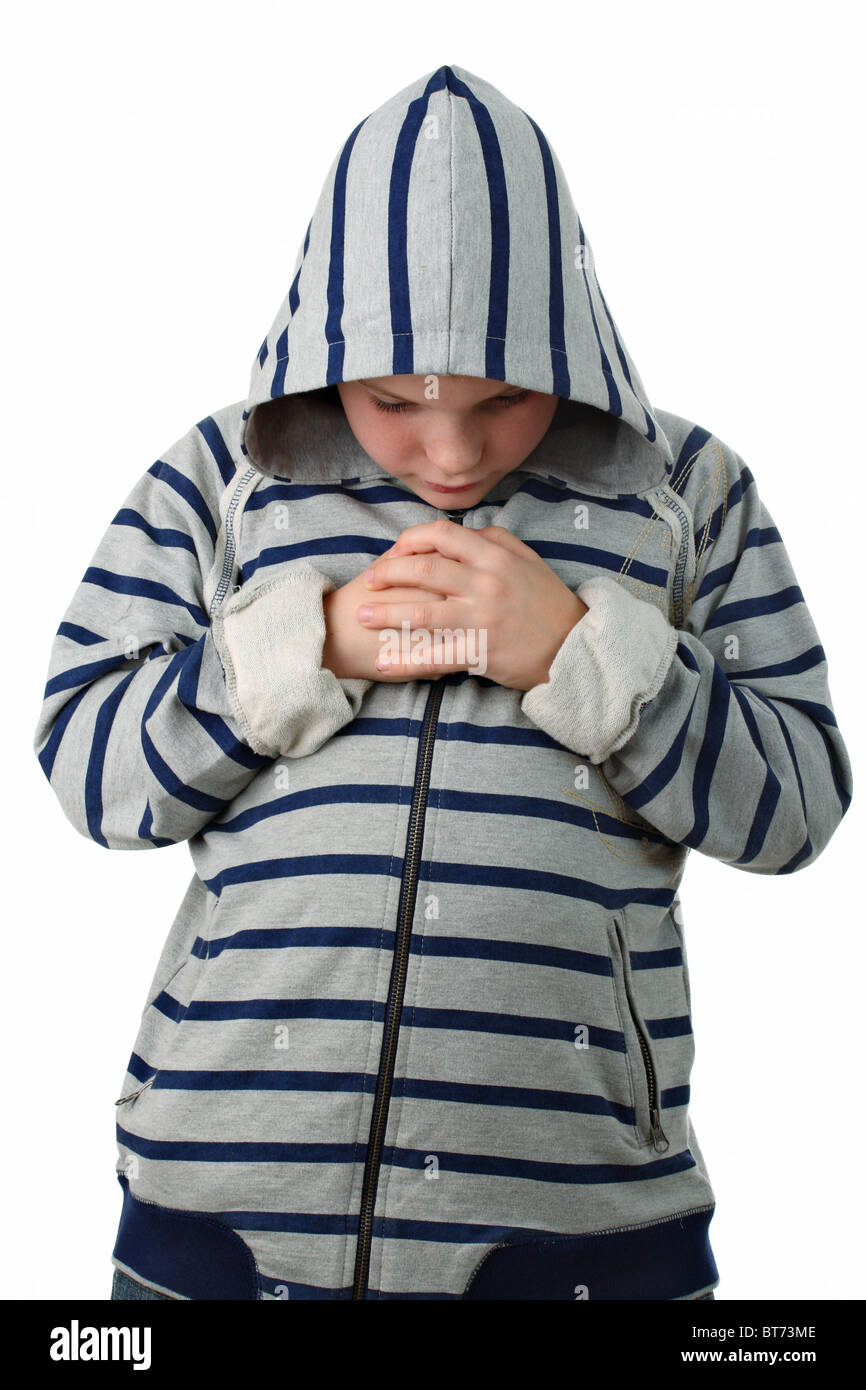 Petit garçon prière avant le match de sport isolated on white Banque D'Images