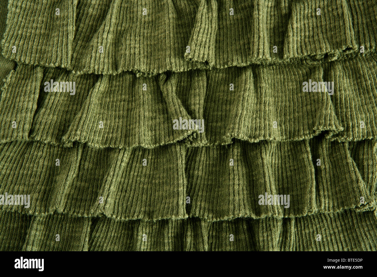 Jupe plissée en tissu vert de mode macro closeup Banque D'Images