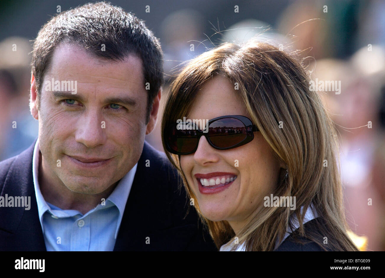 Star hollywoodienne, actorJohn Travolta avec sa femme Kelly Preston au polo match de charité dans le Gloucestershire, Royaume-Uni Banque D'Images