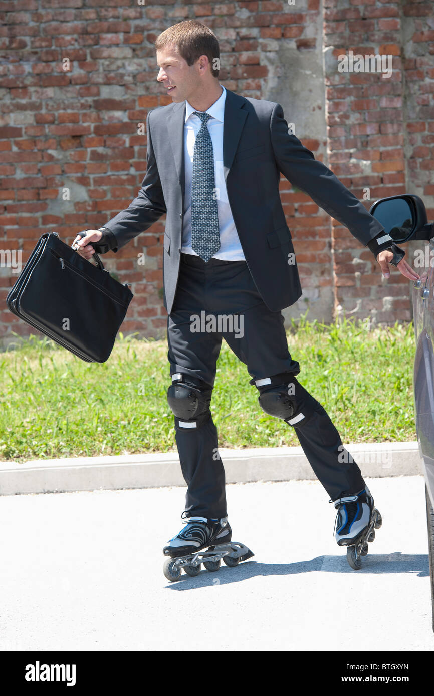 Man in suit roller Banque D'Images