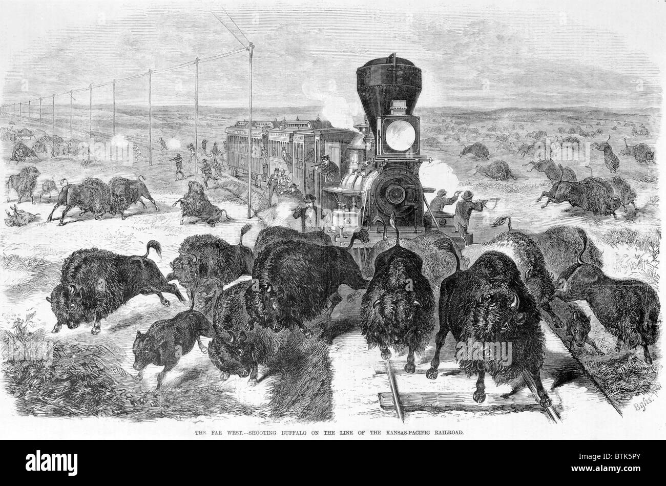 Tir des chasseurs à un troupeau de bisons d'un train et le long des voies, le far west - buffalo tir sur la ligne du chemin de fer Kansas-Pacific, gravure sur bois, 1871 Banque D'Images