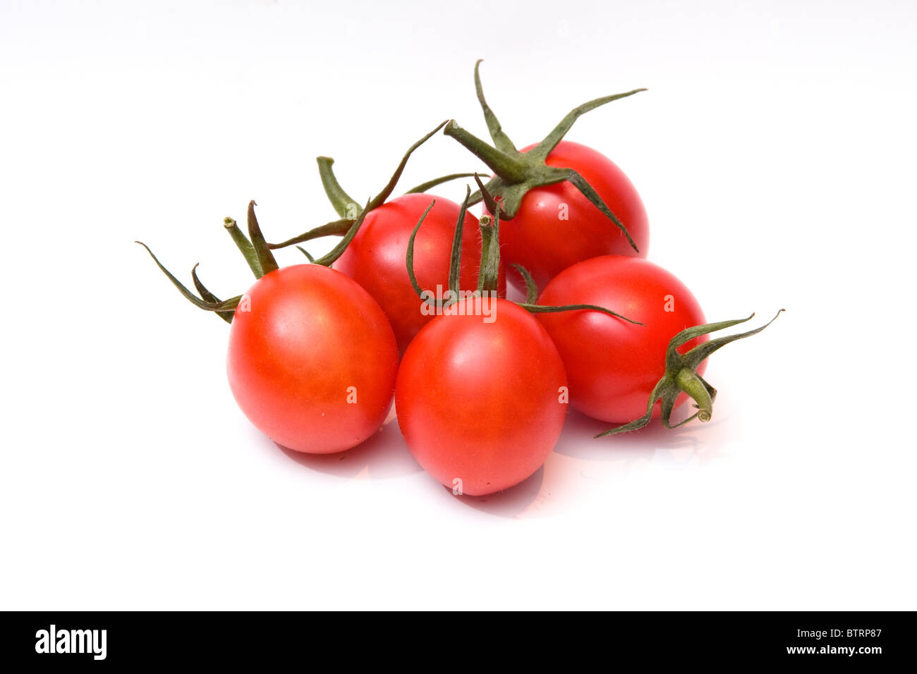 Tomates mûres isolé sur fond blanc Banque D'Images
