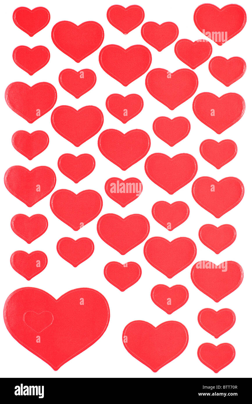 Coeurs rouges autocollants texture, fond blanc. Banque D'Images