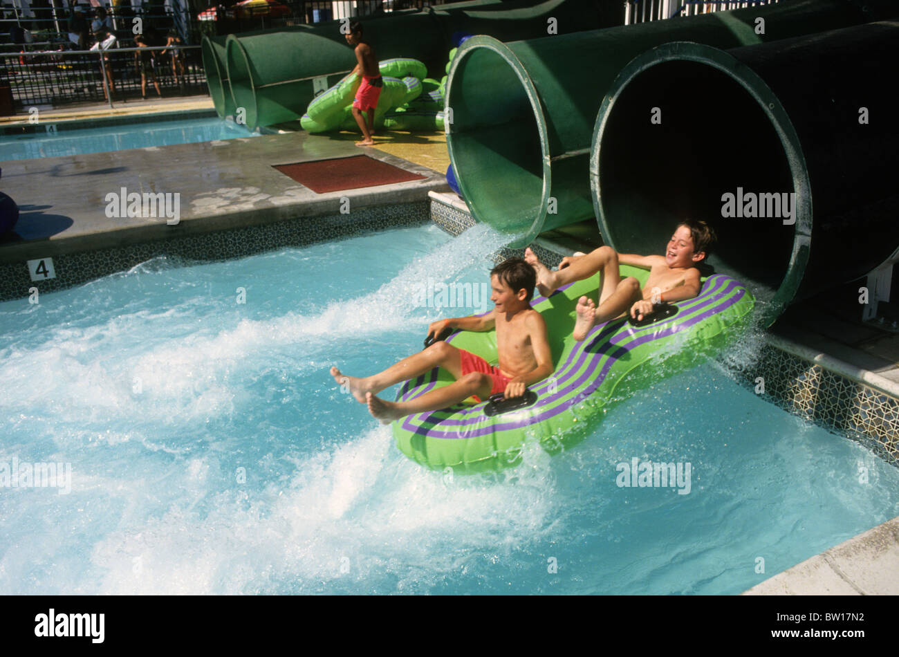 Teen boy homme toboggan toboggan fun tube thrill excite maillot speedo  shirtless fast speed splash Photo Stock - Alamy
