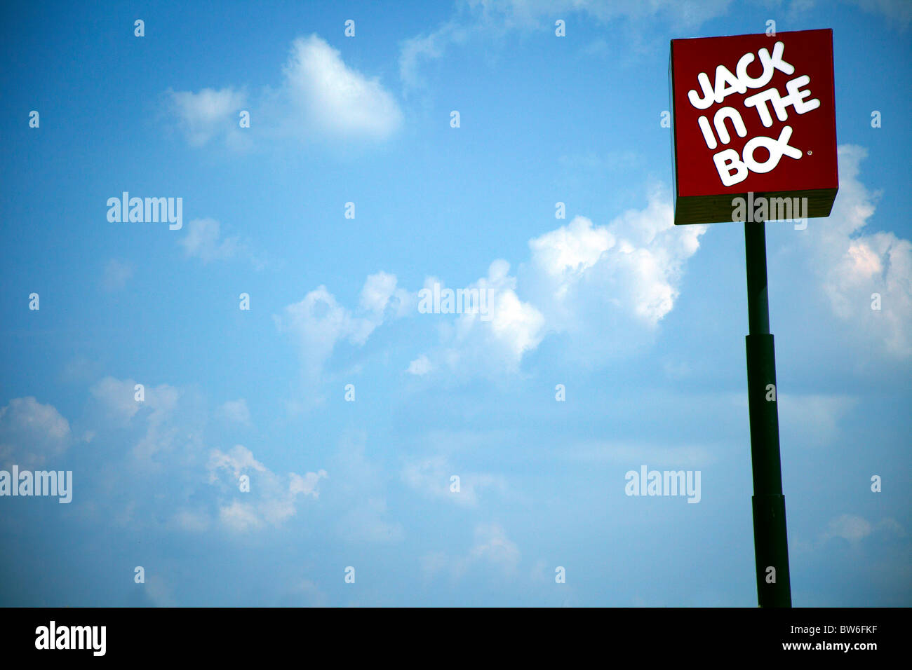Jack in the Box sign against a blue sky Banque D'Images