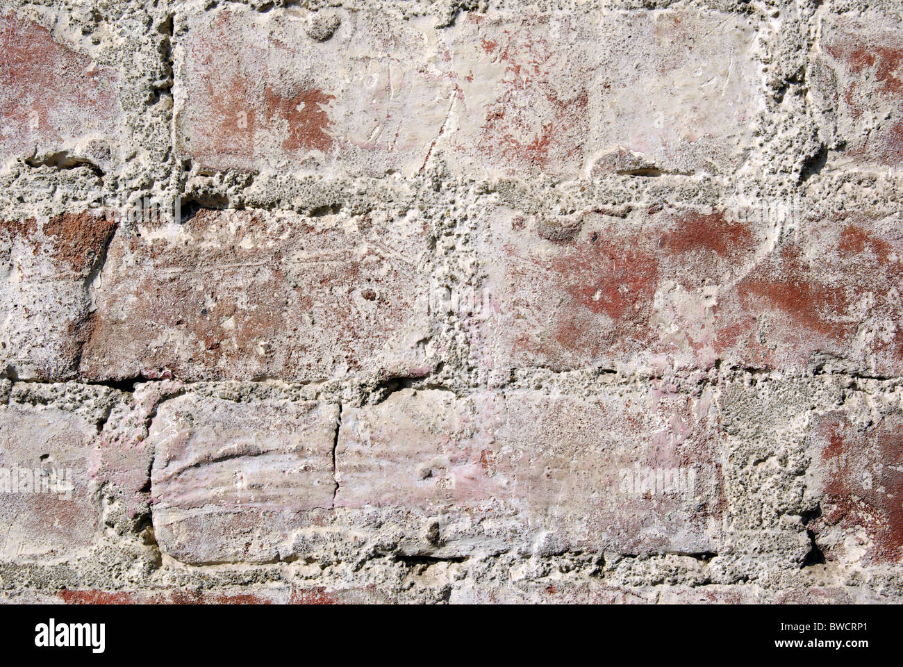 Très vieux mur de brique rouge de près. L'arrière-plan. Banque D'Images