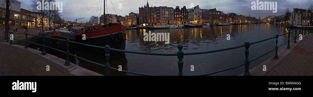 Pays-bas Hollande Europe Amsterdam Amstel River city ville d'hiver de l'eau nuit Soirée bateaux navires christ Banque D'Images