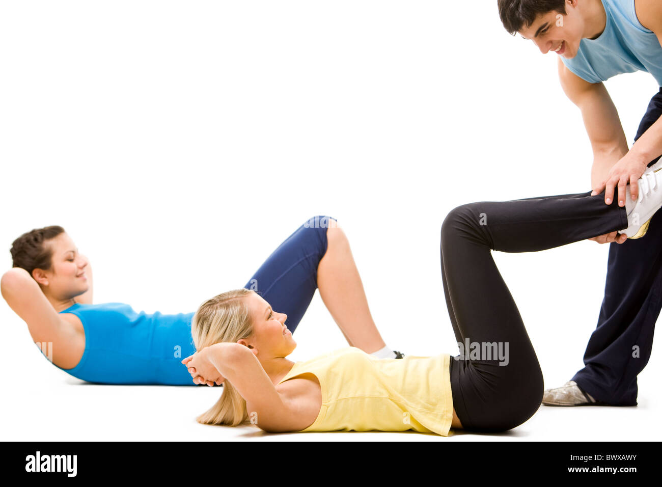 Photo de sportifs faisant l'exercice physique avec l'aide de l'enseignant Banque D'Images