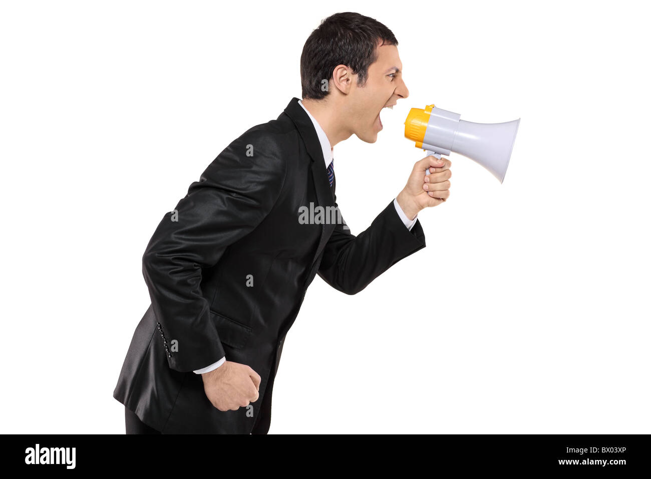 Angry businessman shouting via mégaphone Banque D'Images