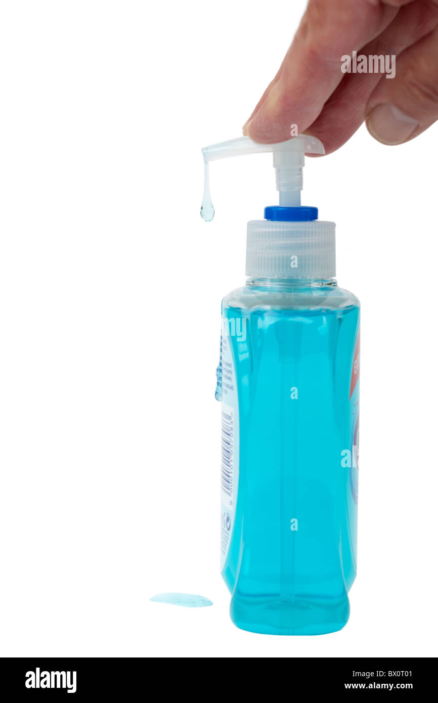 Savon liquide vert s'écoule de son récipient Banque D'Images