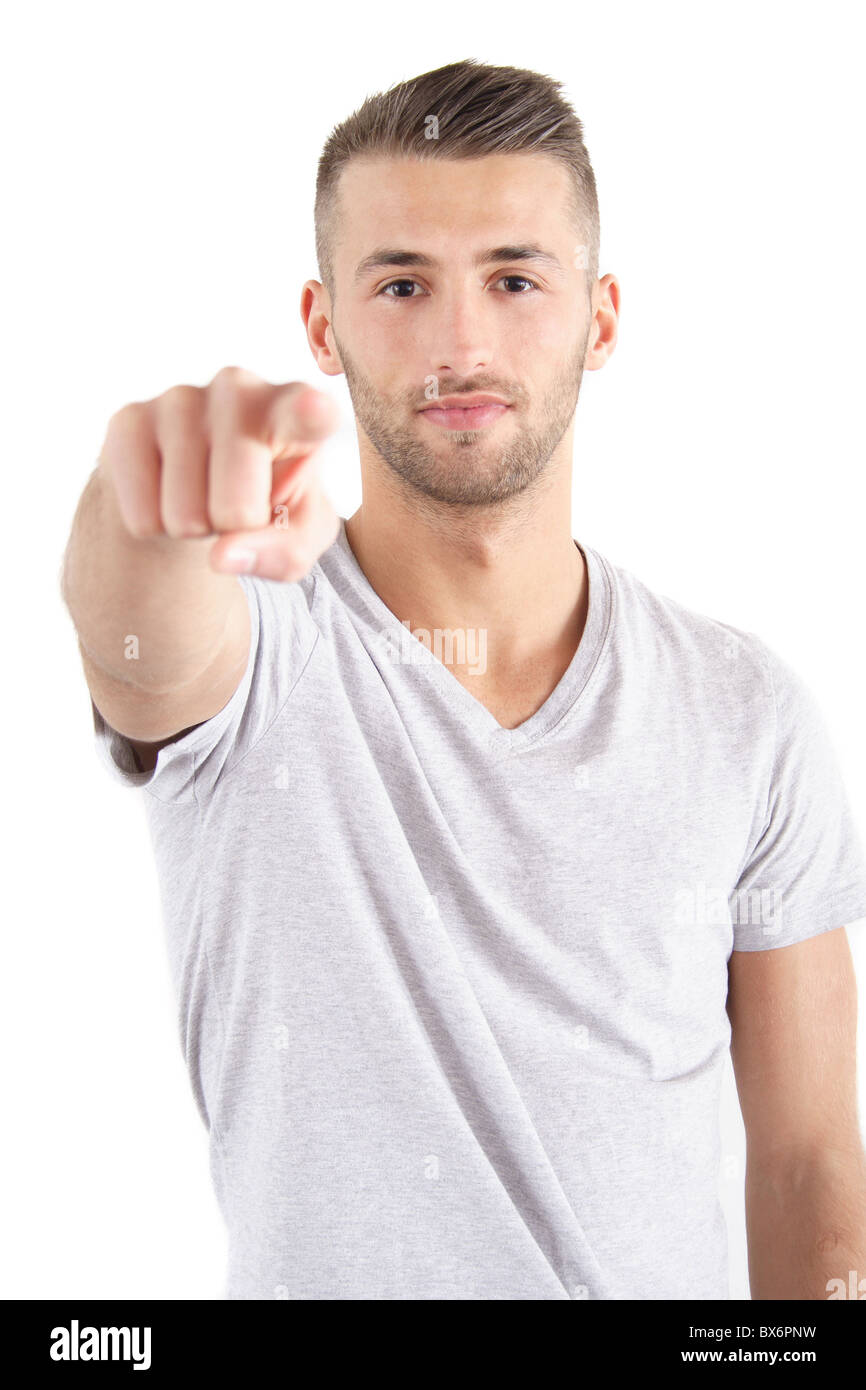 Un bel homme pointant sur quelqu'un ou quelque chose. Tous isolé sur fond blanc. Banque D'Images