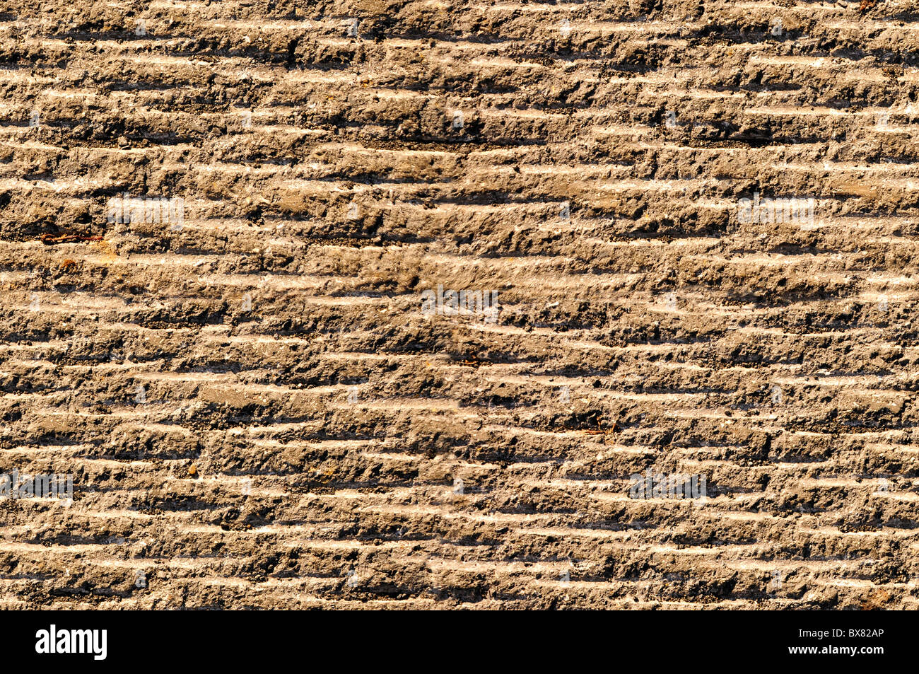 Asphalte rainuré ou rock surface texture parfaitement raccordable Banque D'Images