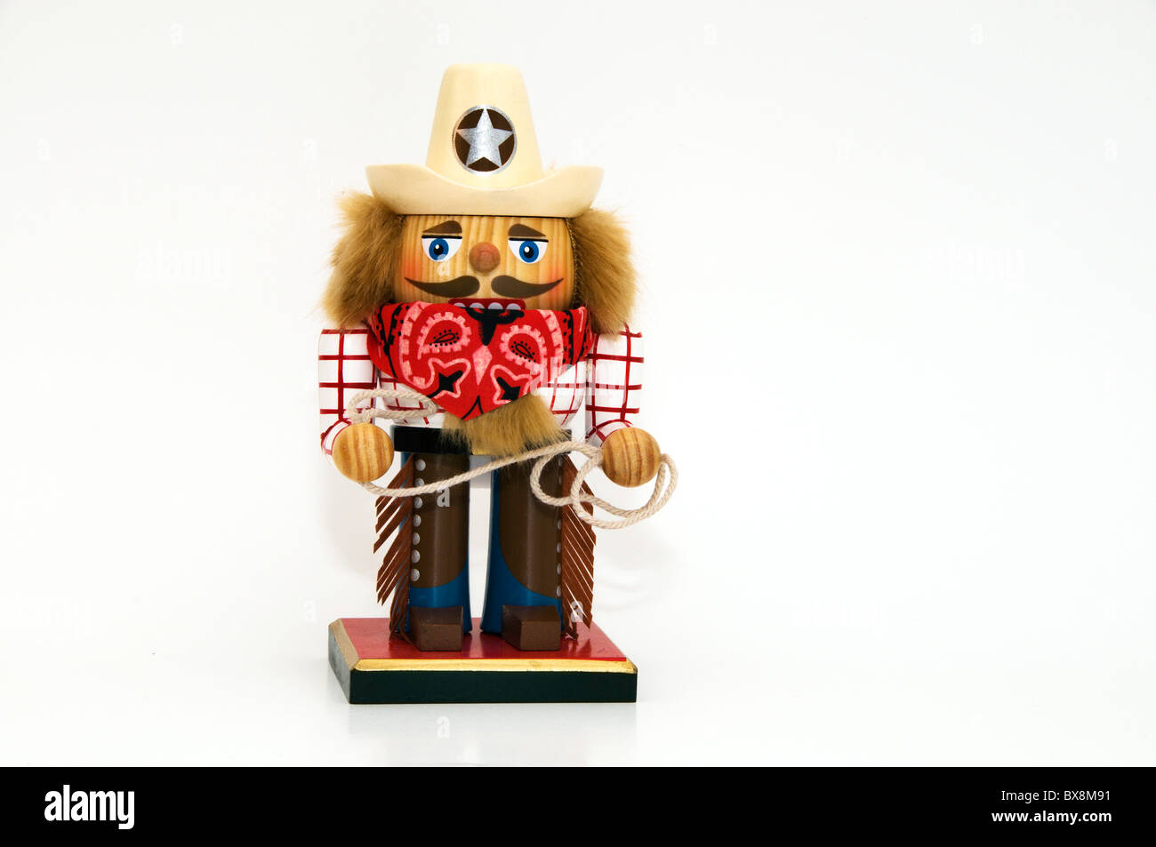 Charmante maison de vacances dans l'ouest habillé de Casse-Noisette et de vêtements portant un sheriff hat et red bandana foulard est titulaire d'un lasso de corde. Banque D'Images