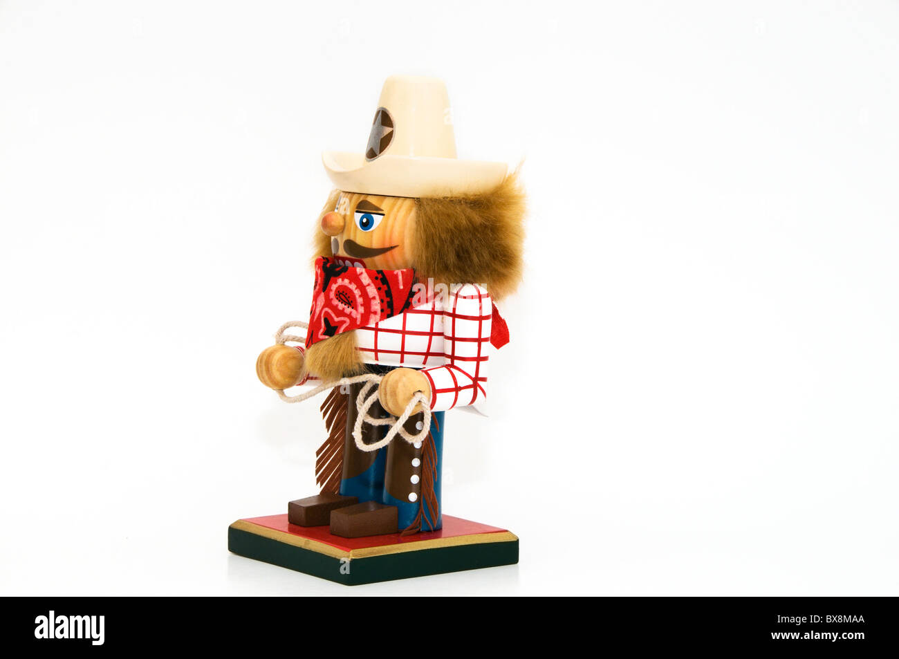 Charmante maison de vacances dans l'ouest habillé de Casse-Noisette et de vêtements portant un sheriff hat et red bandana foulard est titulaire d'un lasso de corde. Banque D'Images