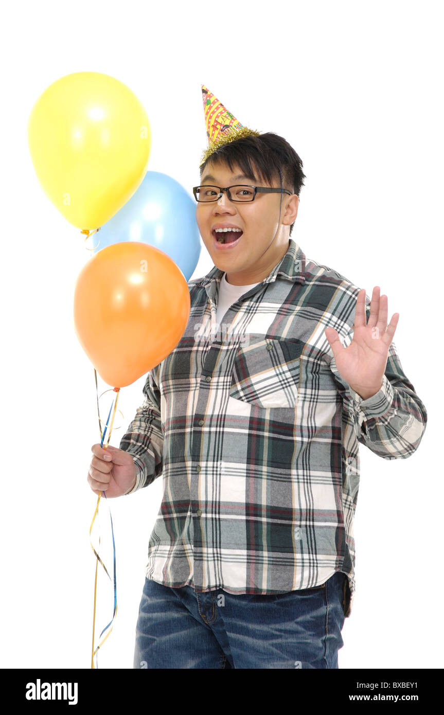 Man holding balloons et agitant la main Banque D'Images Man holding balloons et agitant la main Banque D'Images