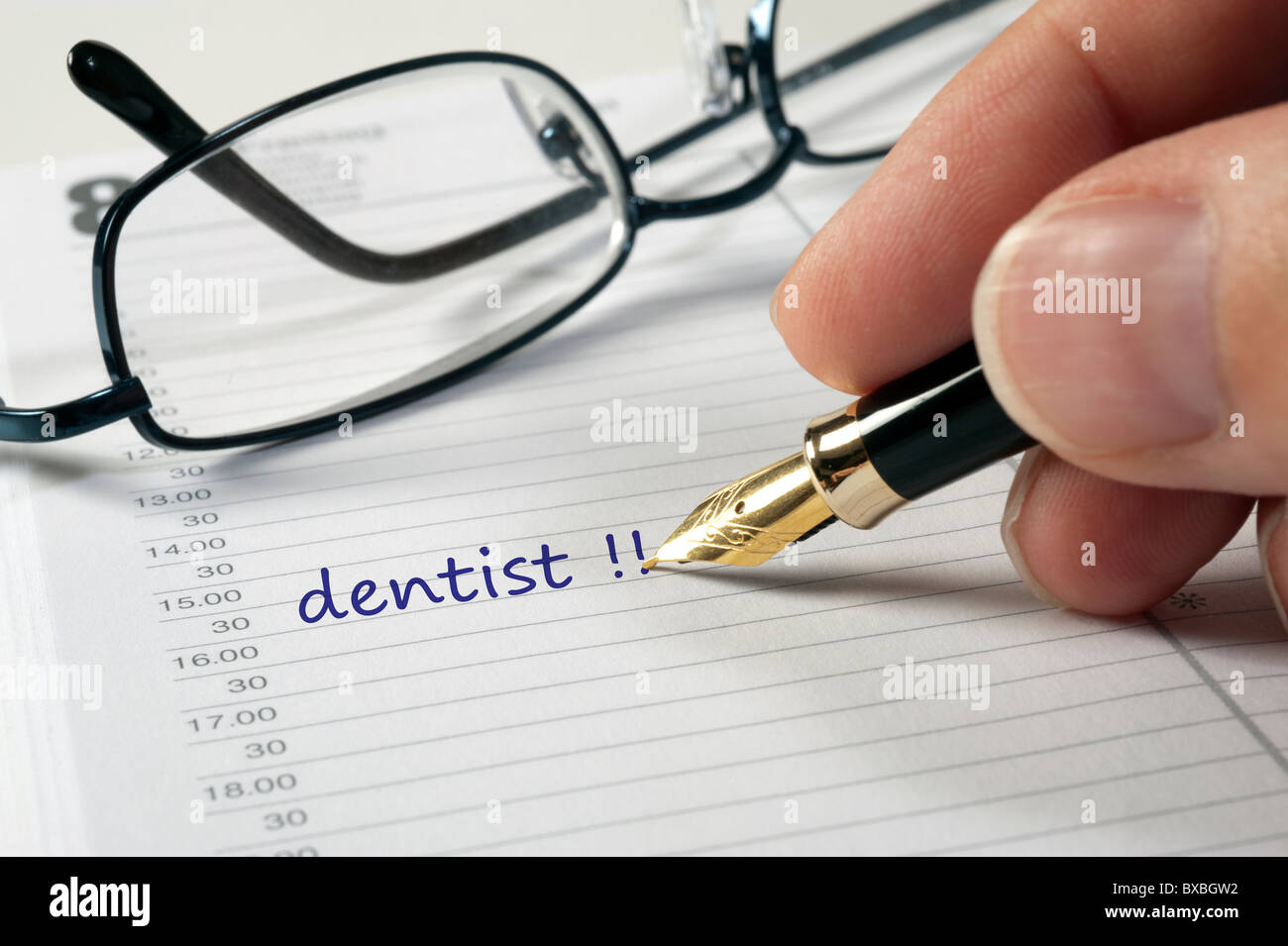 Médecin Dentiste date written dans calendrier Banque D'Images