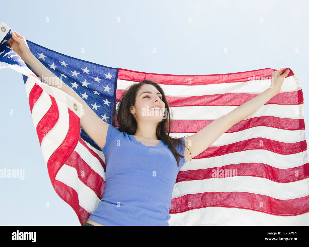 Woman holding American flag Banque D'Images