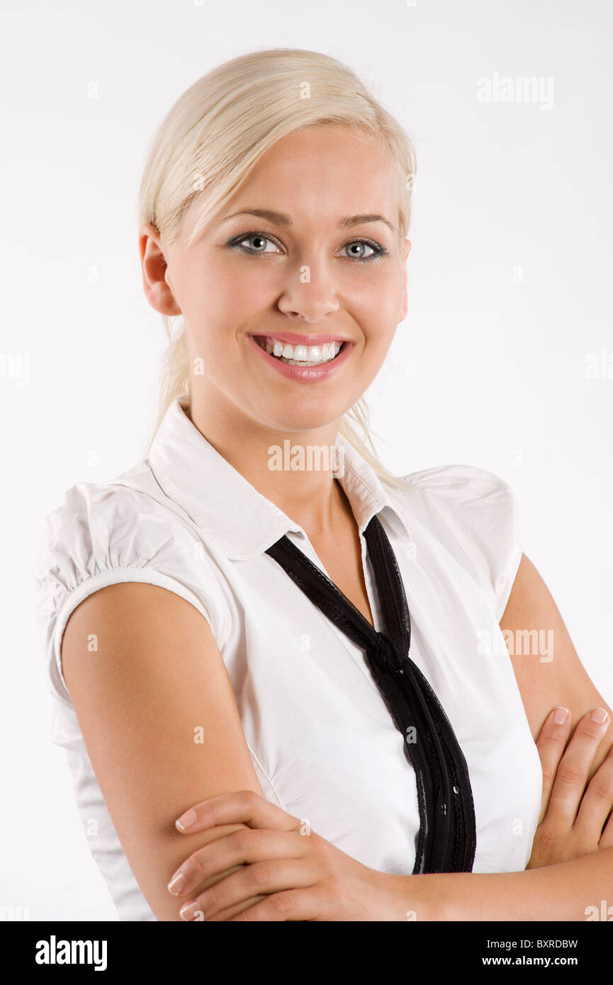 Blonde jeune et mignon femme en tenue habillée comme une secrétaire avec  chemise blanche et cravate Photo Stock - Alamy