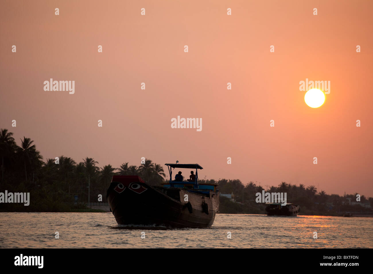 Le coucher du soleil, Ben Tre, Delta du Mekong, Vietnam Banque D'Images