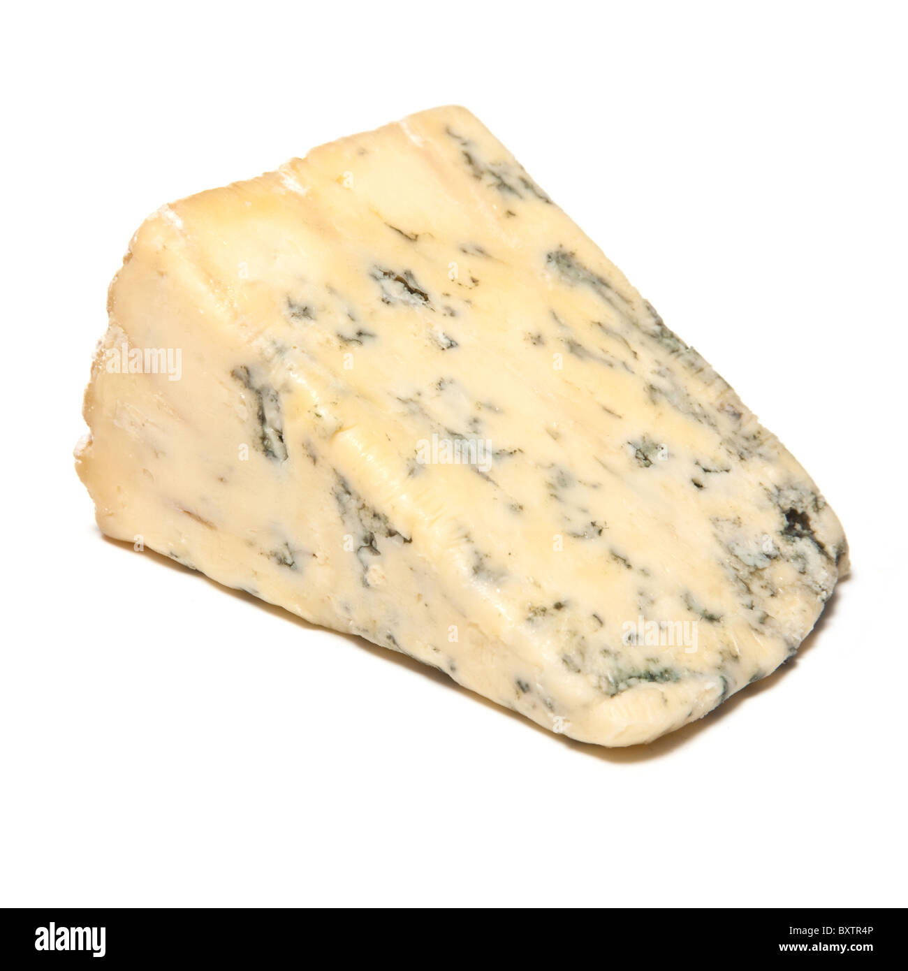 Blue Stilton cheese wedge isolated on a white background studio. Banque D'Images