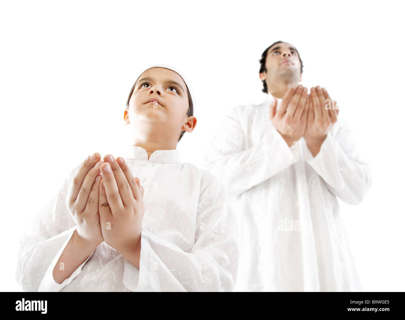 Musulman et son fils priant Banque D'Images
