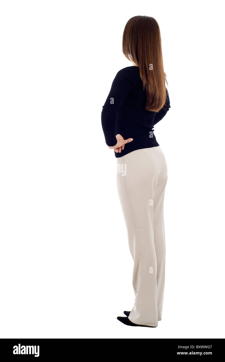 Femme d'affaires de l'arrière - regarder quelque chose sur un fond blanc Banque D'Images
