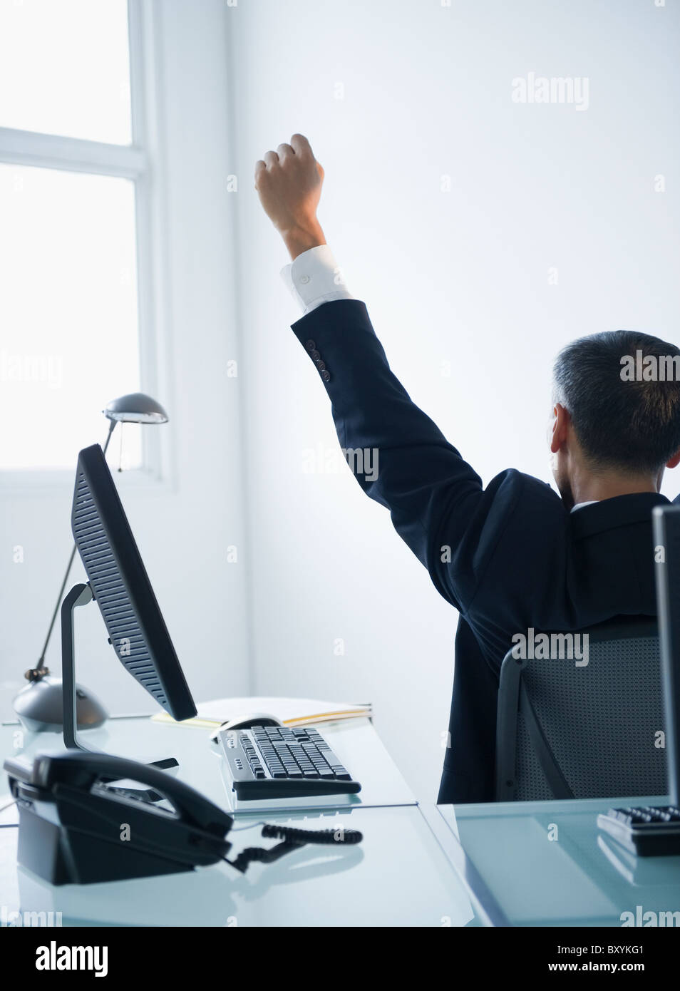 Businessman with Edith assis dans office Banque D'Images