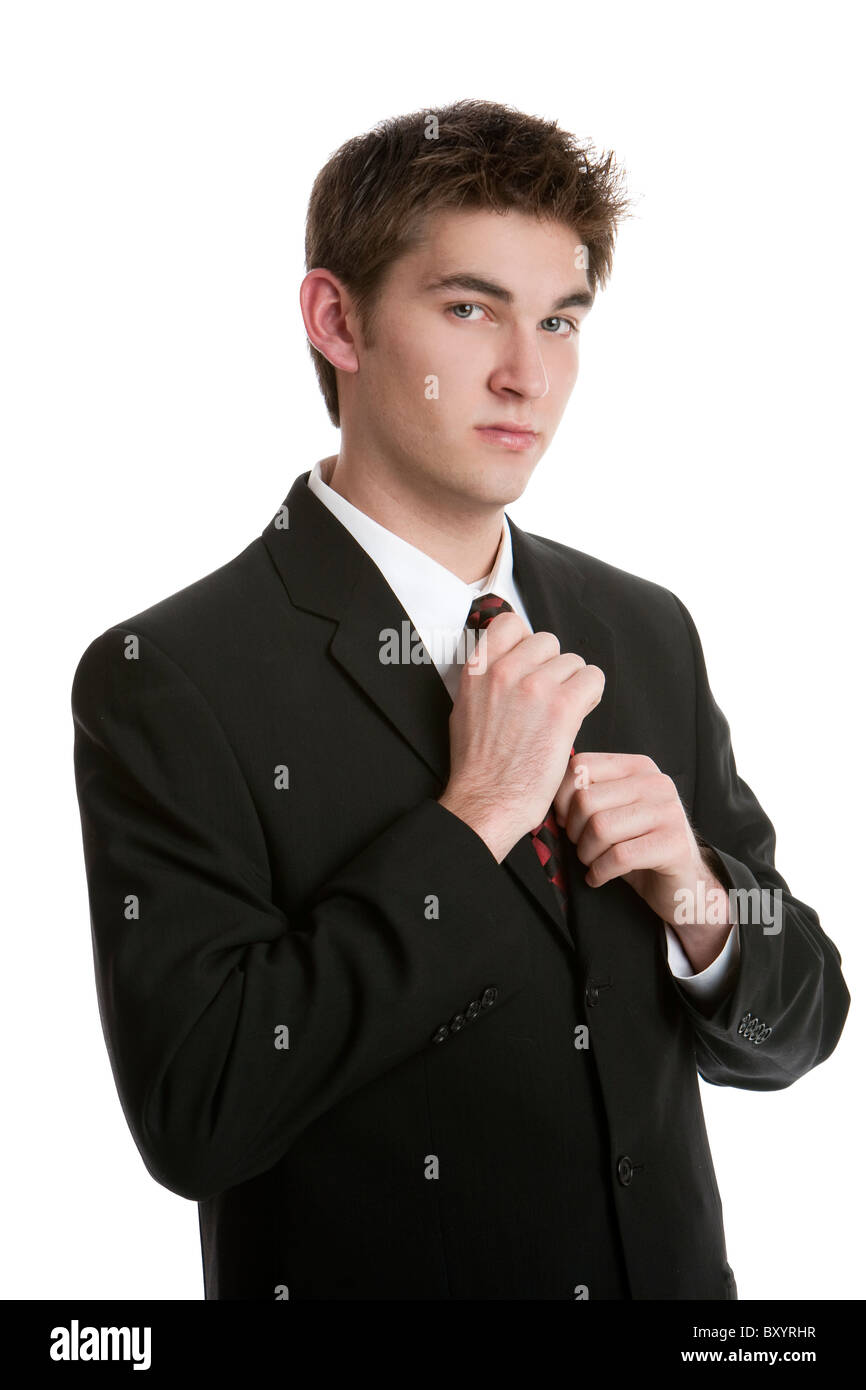 Belle adolescent vêtu d'un costume cravate de réglage isolé sur fond blanc  Photo Stock - Alamy
