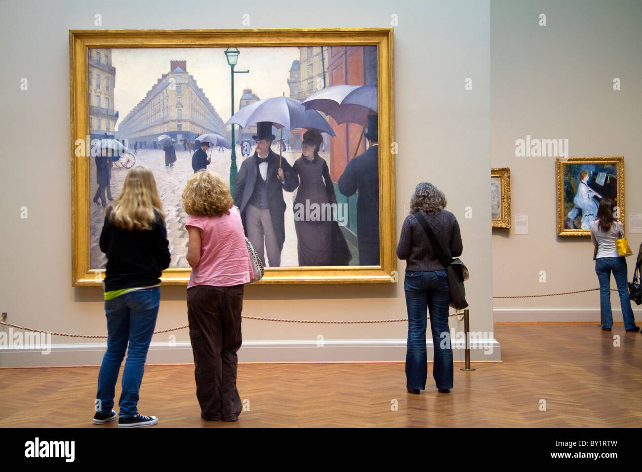 Rue de Paris ; Jour de pluie peinture de Gustave Caillebotte affichée à l'Art Institute de Chicago, Illinois, USA. Banque D'Images