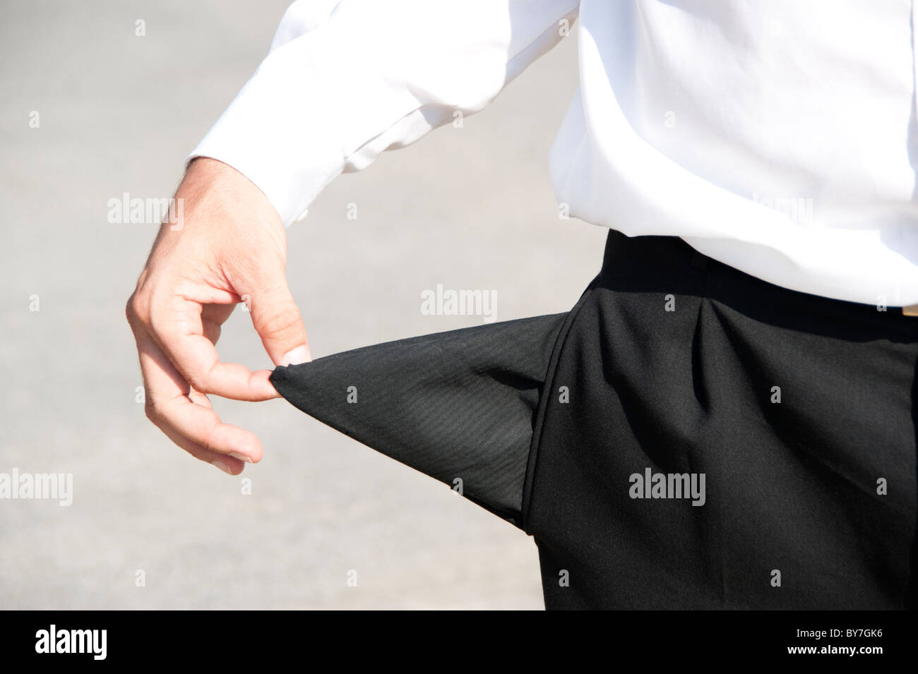 Businessman with empty pocket Banque D'Images
