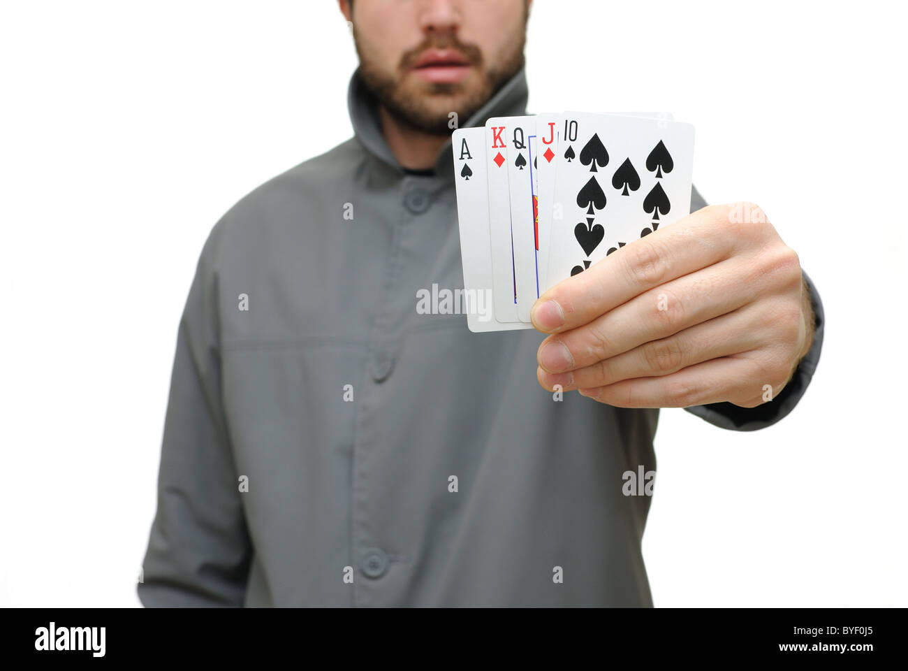 Quinte Flush Royale dans une main isolé sur un fond blanc. Banque D'Images