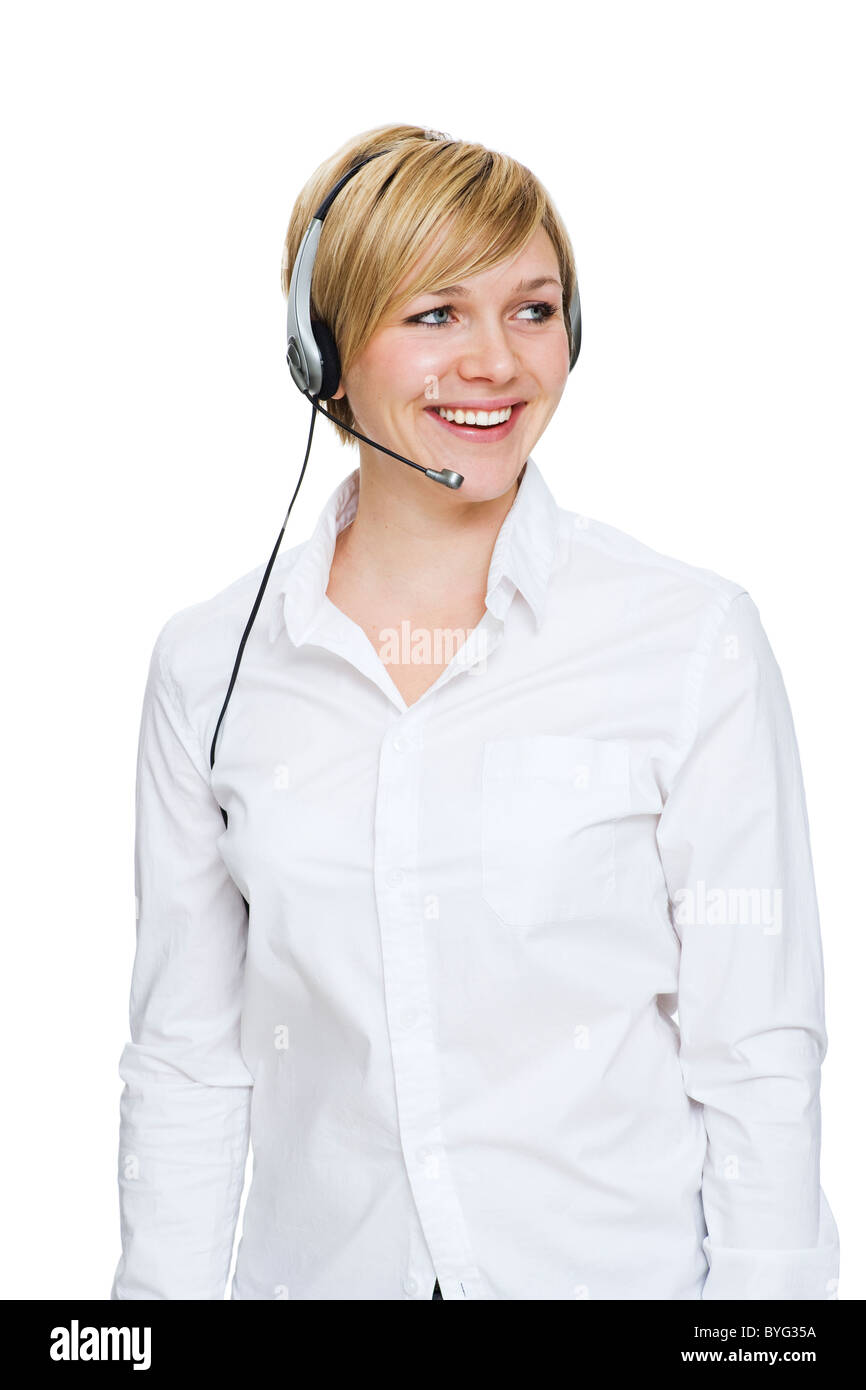 Réceptionniste au casque against white background, smiling Banque D'Images