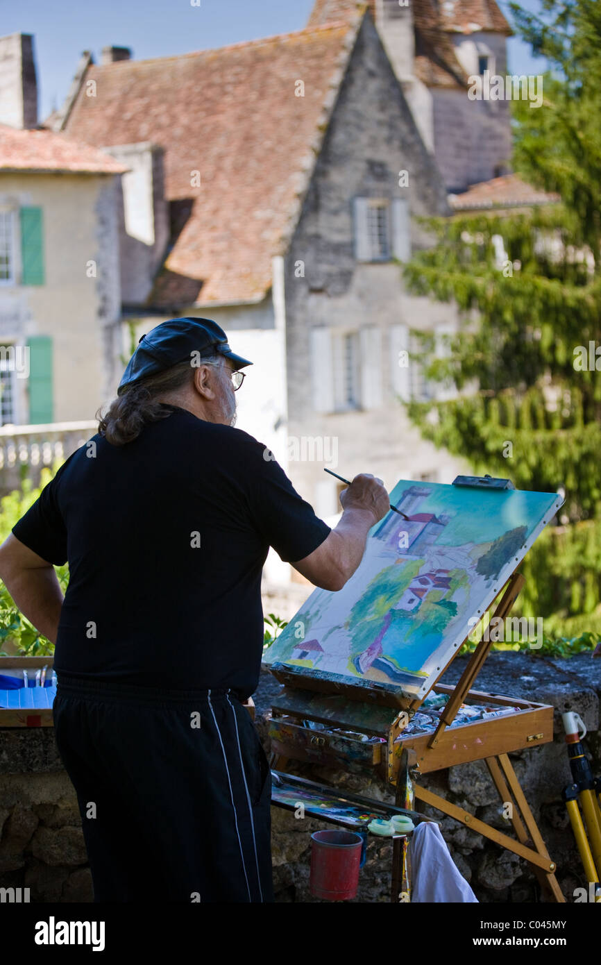 Peinture artiste ville de Bourdeilles destination touristique populaire près de Brantôme, dans le Nord de la Dordogne, France Banque D'Images