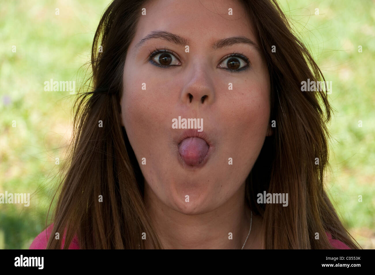 Naughty young woman making faces - Heureux - facétieux Banque D'Images