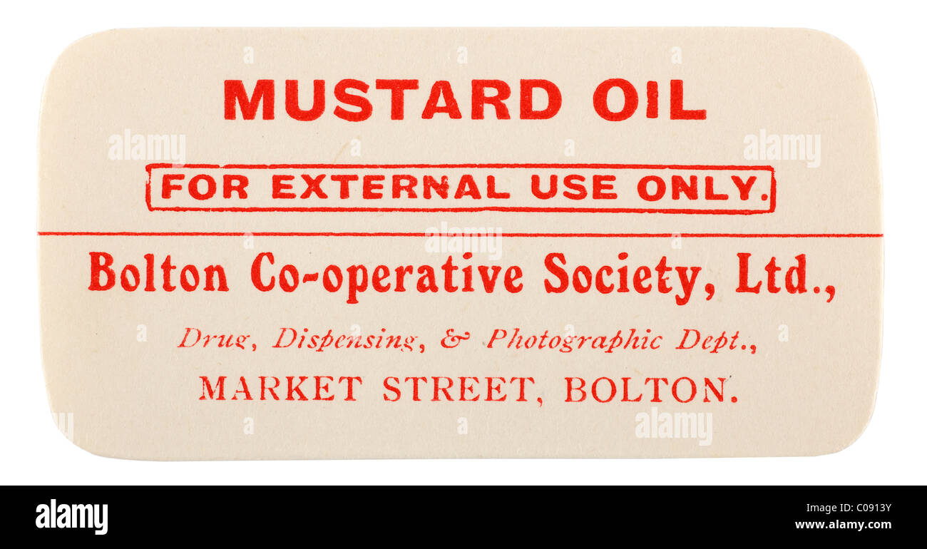 Old vintage pharmacie étiquette pour l'huile de moutarde de Bolton Co operative Society Ltd. EDITORIAL SEULEMENT Banque D'Images
