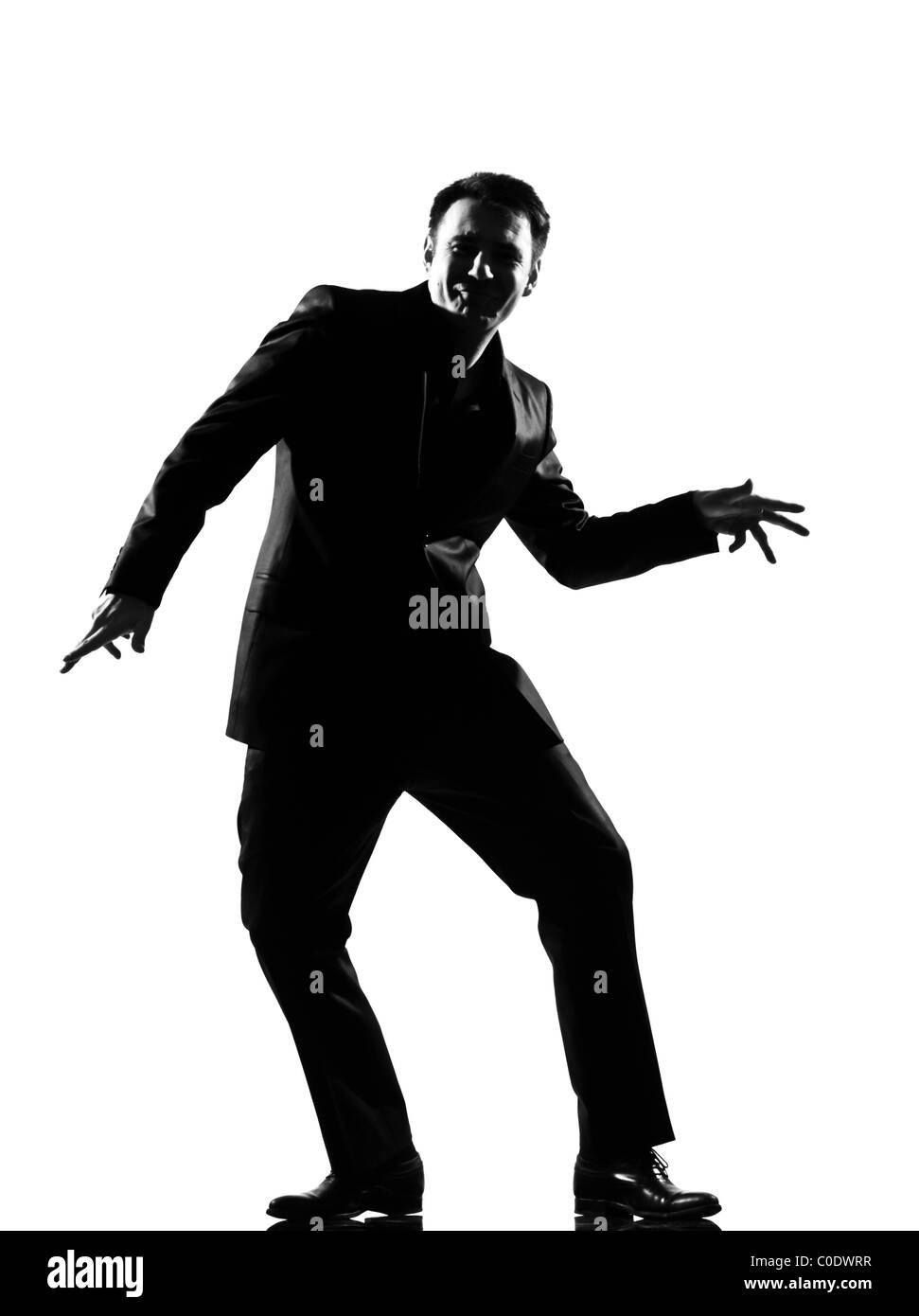 Silhouette caucasian business man exprimant la danse heureux montrant toute la longueur du comportement sur studio isolé sur fond blanc Banque D'Images