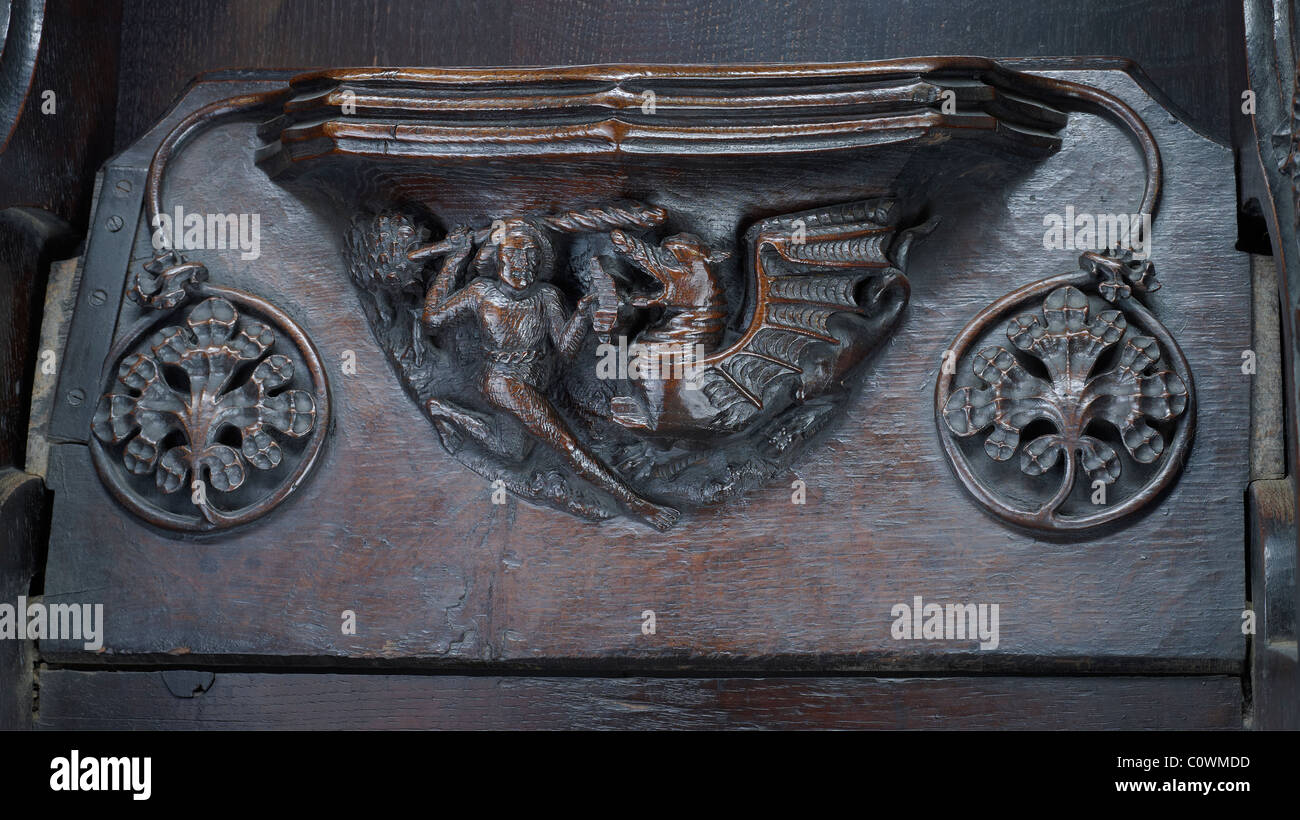 La Cathédrale de Manchester Misericord : Homme & Wyvern Banque D'Images