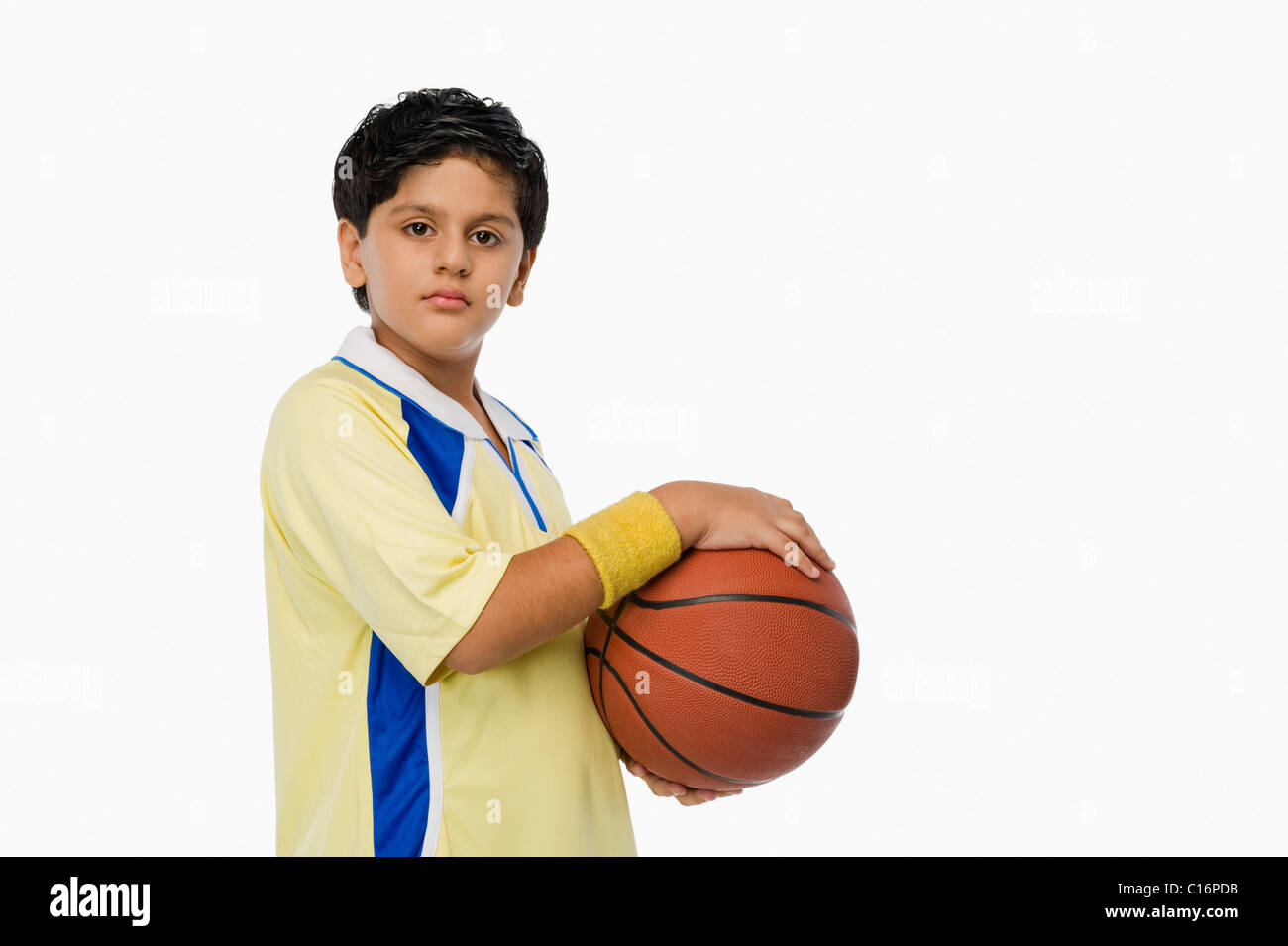 Portrait of a Boy holding a basket-ball Banque D'Images
