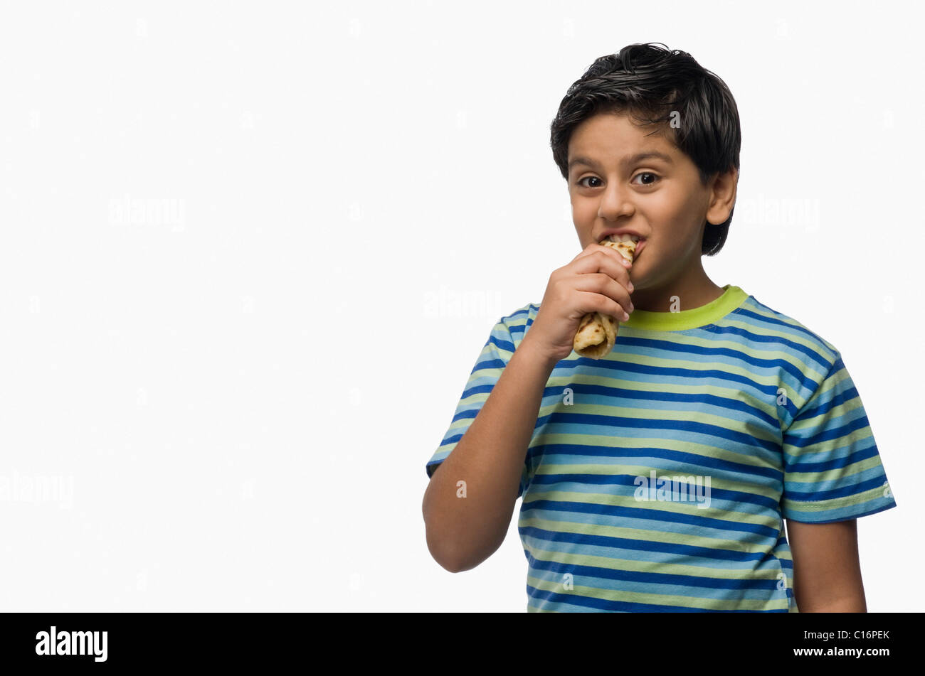 Portrait of a Boy eating bread Banque D'Images