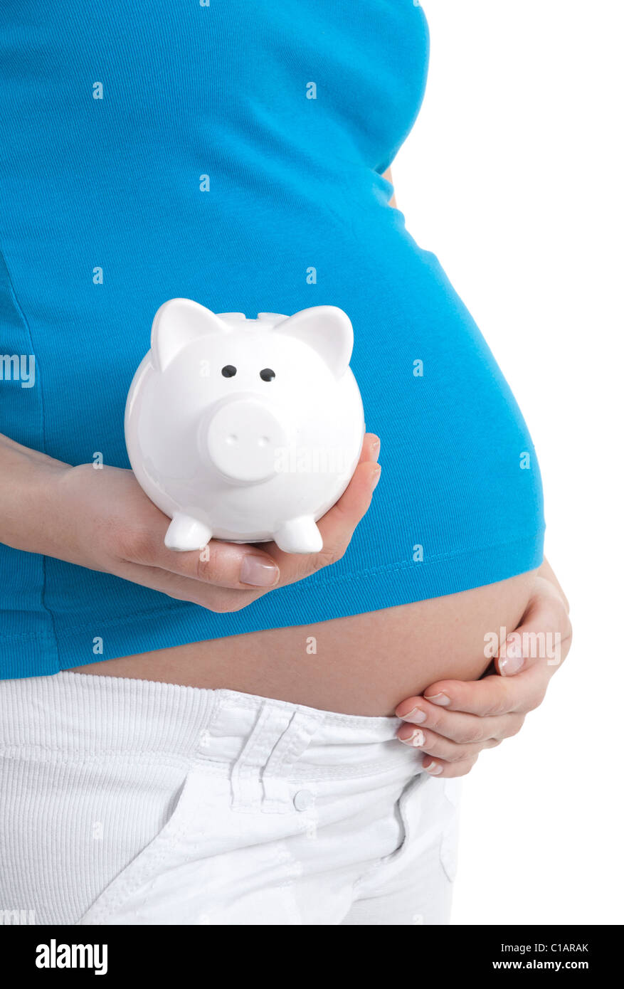 Pregnant woman holding piggybank Banque D'Images