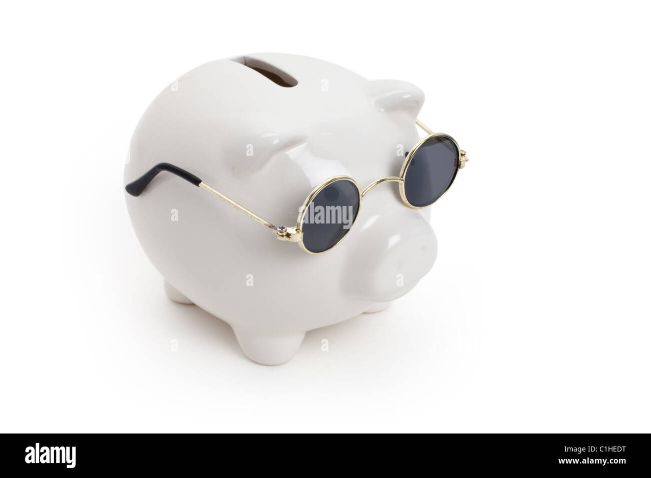 Tirelire et lunettes , concept de l'épargne Banque D'Images