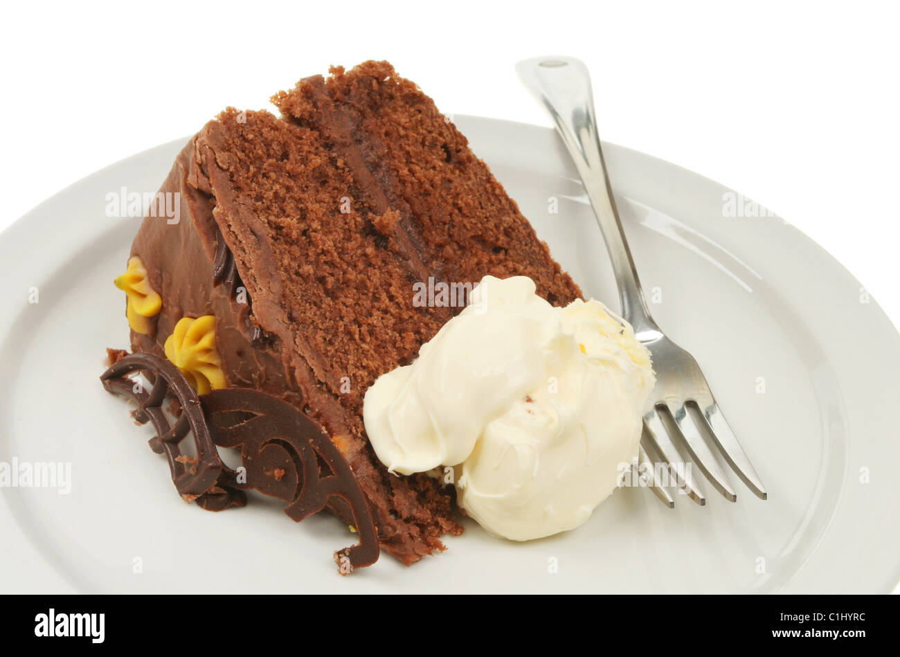 Moelleux au chocolat et crème caillée sur une assiette avec une fourchette Banque D'Images