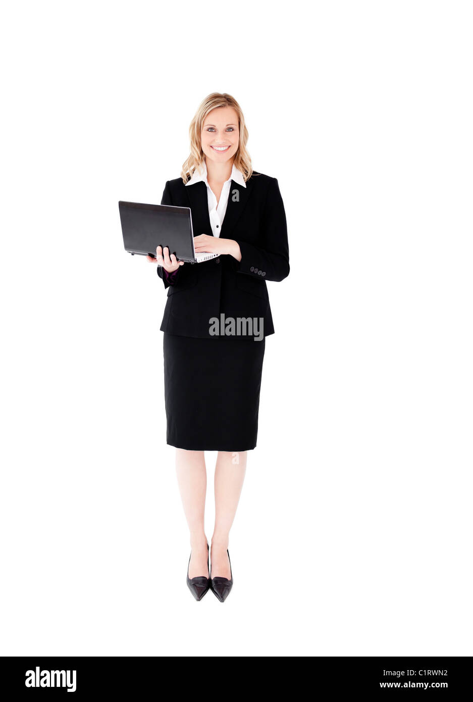 Ravi businesswoman using her laptop debout Banque D'Images