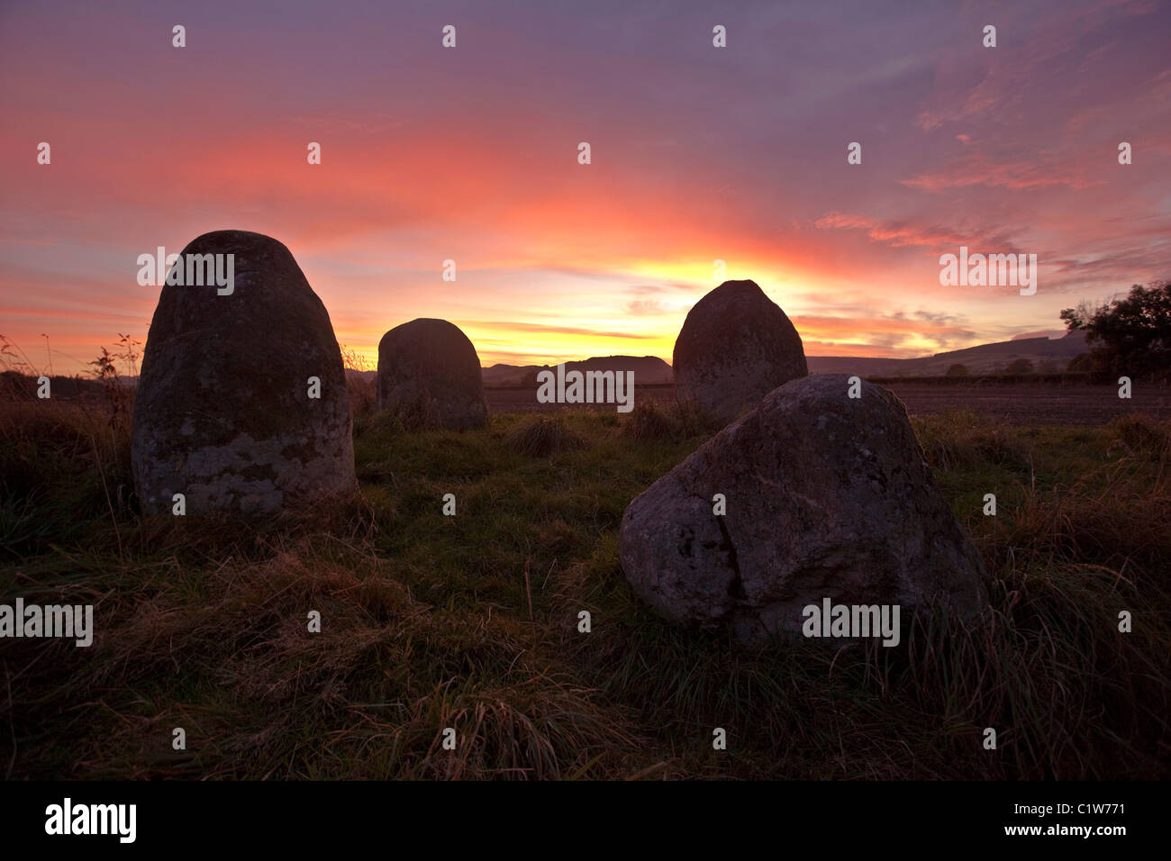 Les quatre pierres au coucher du soleil, près de Walton, Powys, Wales Banque D'Images