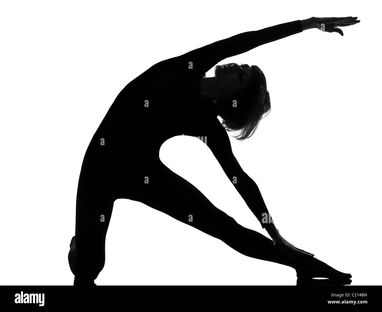 Femme parighasana porte yoga posture pose position dans la silhouette studio sur fond blanc Banque D'Images