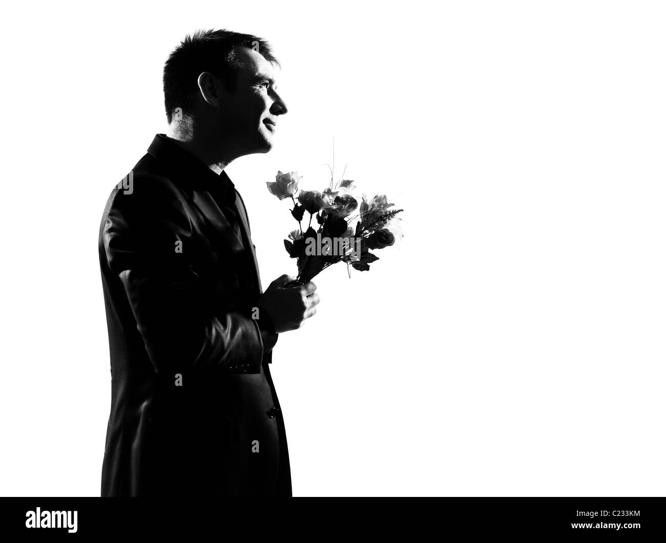 Silhouette caucasian business man fleurs exprimant toute la longueur du comportement sur studio isolé sur fond blanc Banque D'Images