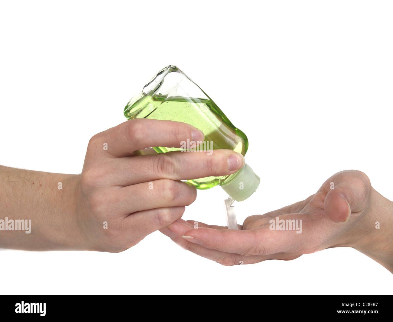 Woman squeezing lotion pour les mains vertes sur ses mains. Banque D'Images
