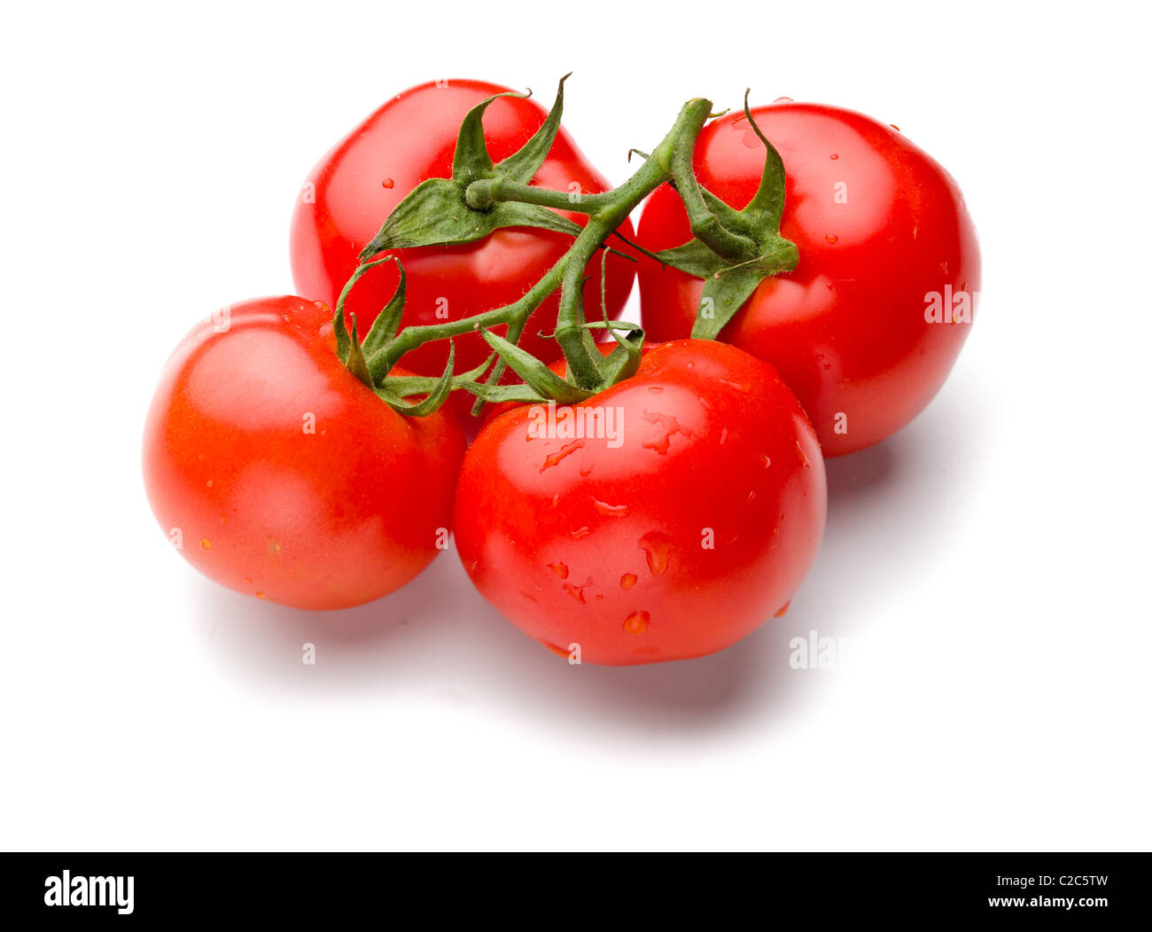 Les tomates juteuses isolé sur fond blanc Banque D'Images
