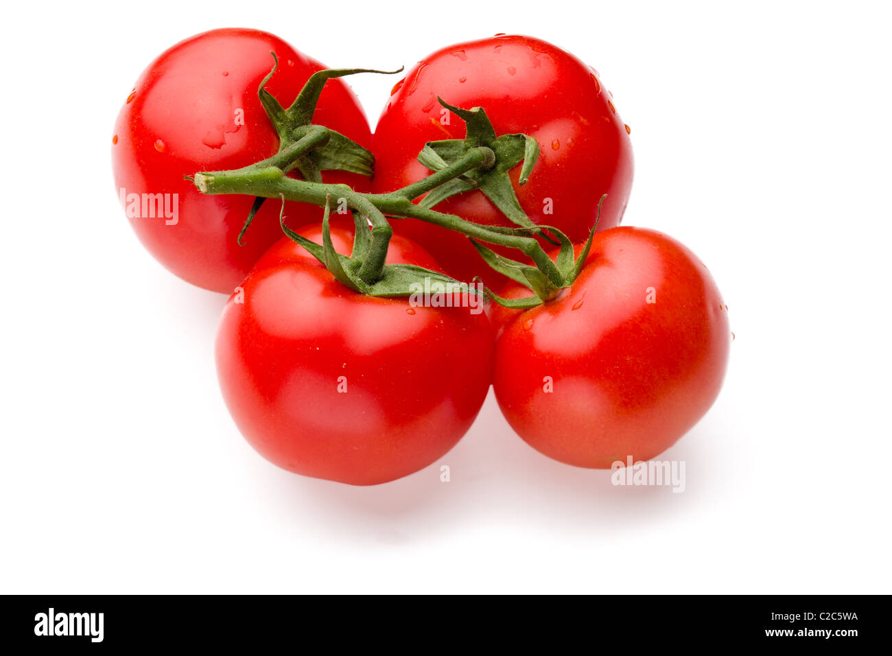 Les tomates juteuses isolé sur fond blanc Banque D'Images